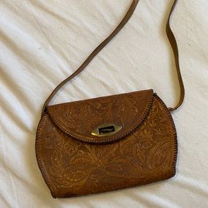 Vintage stamped leather shoulder bag.